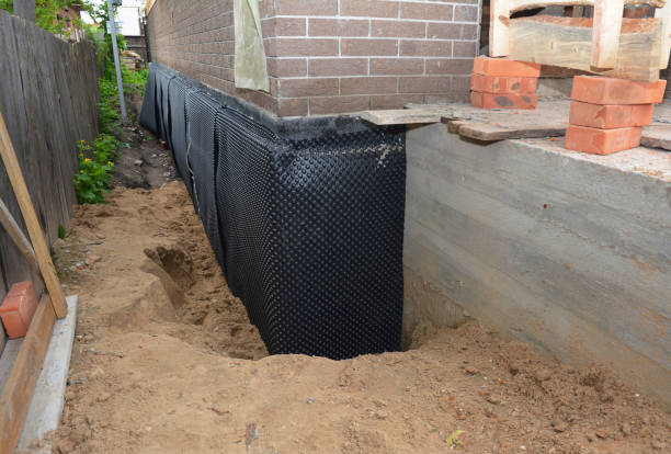 Happy homeowners after waterproofing job in Glen Echo